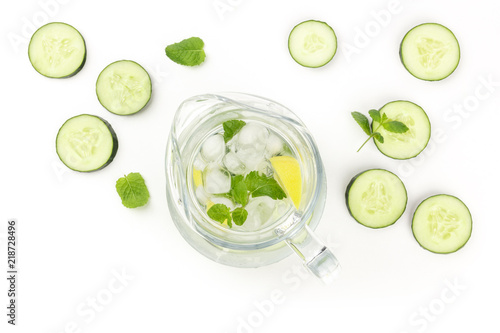 Cucumber, lemon and mint lemonade in a jar on a white background with copyspace