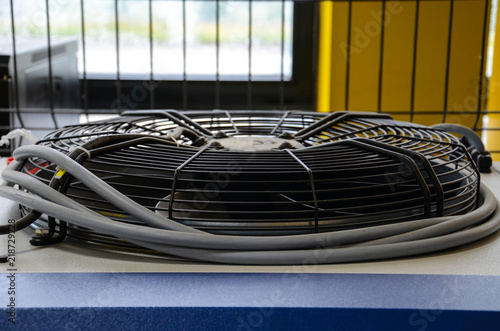 HVAC (Heating, Ventilation and Air Conditioning) spinning blades. Industrial ventilation fan background.
