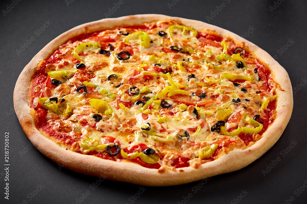 Hot pizza on black background for lunch or dinner crust. Pizza menu.