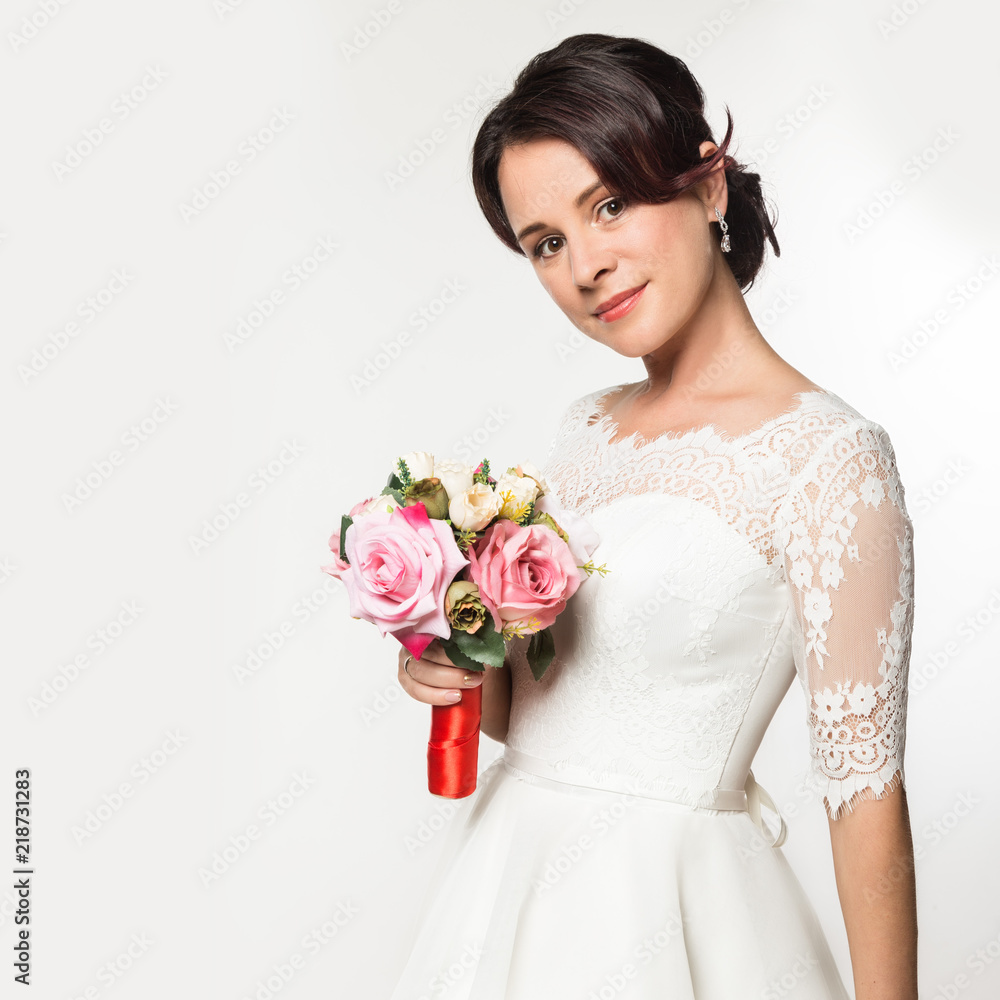 elegant bride on a light background. Beautiful wedding bouquet in a bride hands. free space for your text elegant bride on a light background. Beautiful wedding bouquet in a bride hands. free space for your text