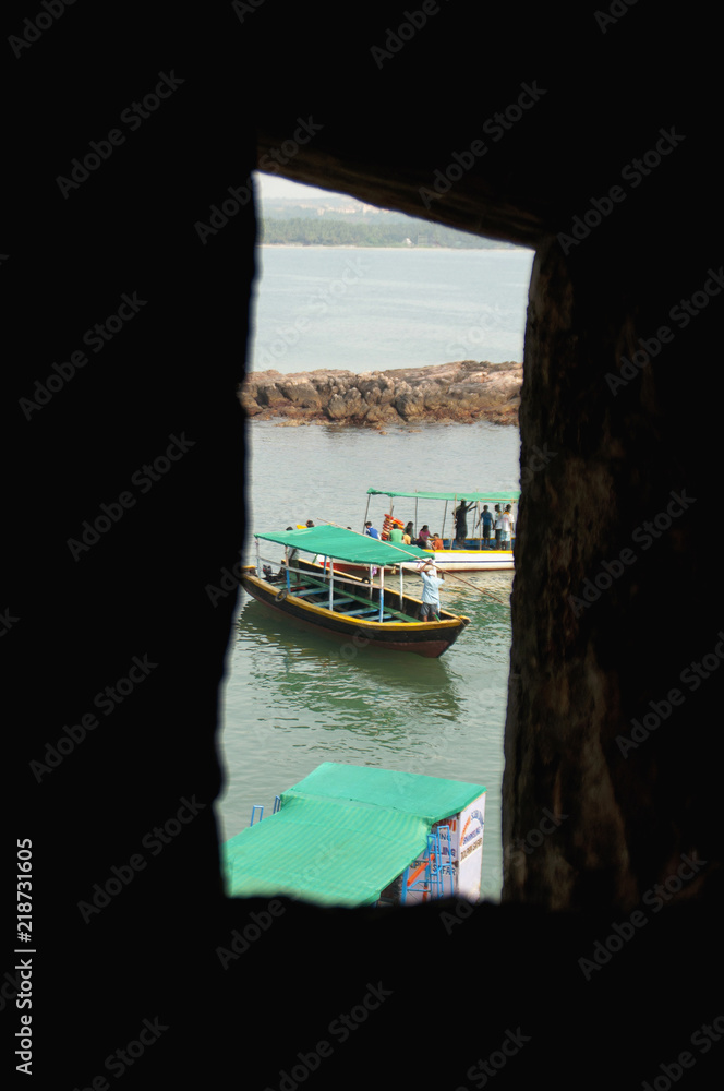 A boat, view from window of a Sindudurga fort Sindhudurga District, Maharashtra, India