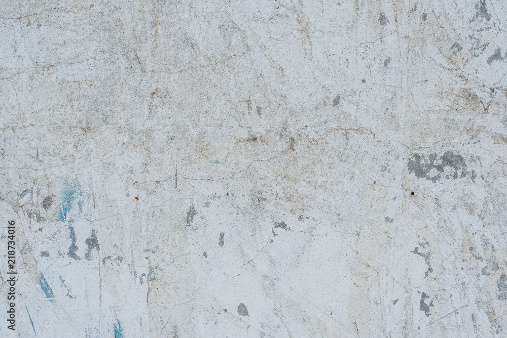 Fototapeta premium Wall fragment with scratches and cracks. It can be used as a background