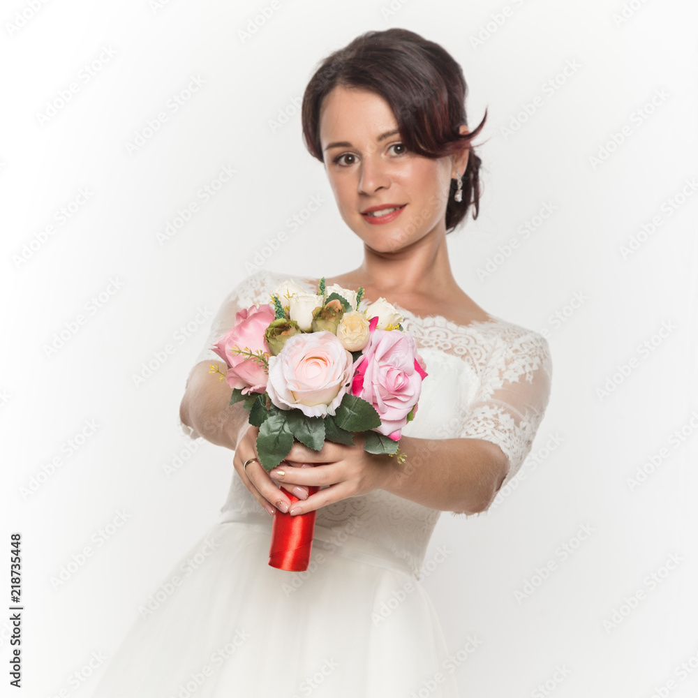 elegant bride with beautiful wedding bouquet in a hands. wedding make-up and hairstyle concept