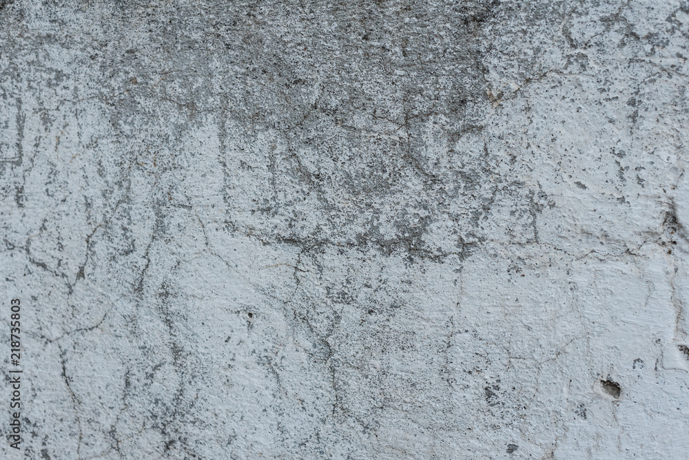 Wall fragment with scratches and cracks. It can be used as a background Wall fragment with scratches and cracks. It can be used as a background