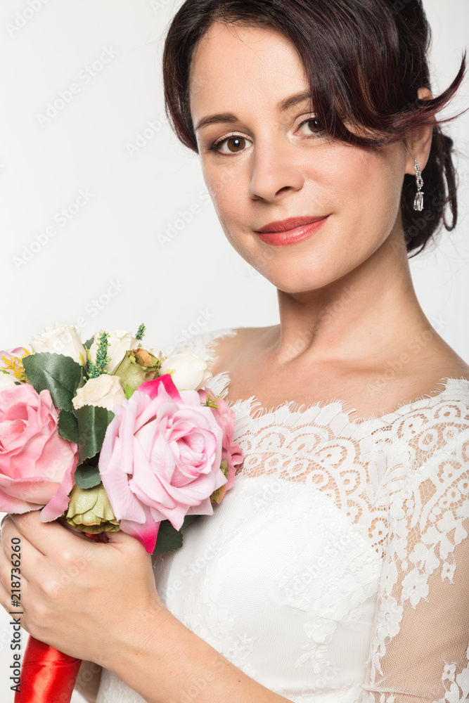 elegant bride with beautiful wedding bouquet in a hands. wedding make-up and hairstyle concept elegant bride with beautiful wedding bouquet in a hands. wedding make-up and hairstyle concept
