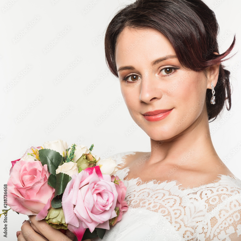 elegant bride with beautiful wedding bouquet in a hands. wedding make-up and hairstyle concept elegant bride with beautiful wedding bouquet in a hands. wedding make-up and hairstyle concept