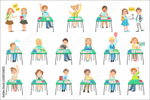 Children Sitting At School Desks In Class