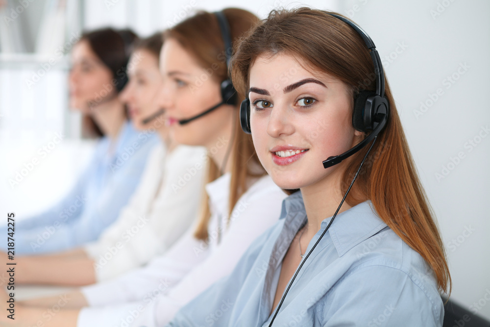 Call center. Beautiful cheerful smiling operator consulting clients with headset. Business concept of customer service Call center. Beautiful cheerful smiling operator consulting clients with headset. Business concept of customer service