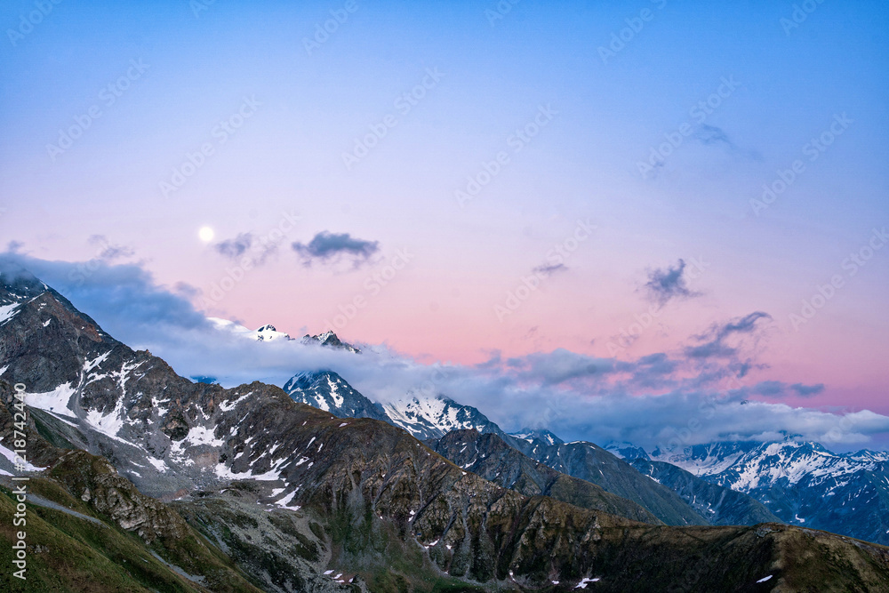 Obraz premium Scenic view of beautiful Swiss Alps mountains. Blue hour sunset with pink and blue tones, Verbier, Canton du Valais, Wallis, Switzerland.