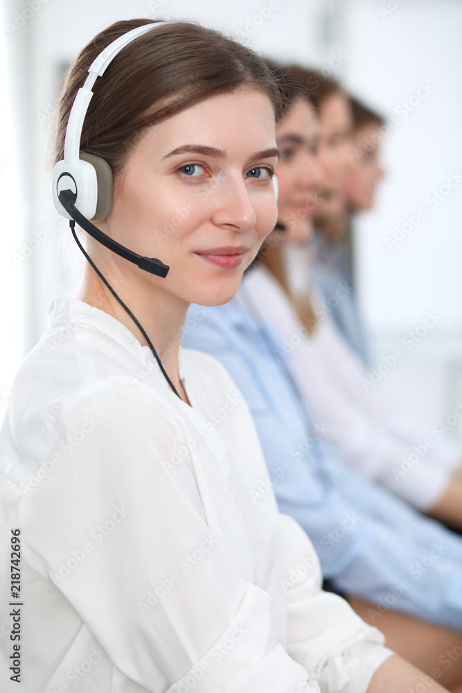 Call center. Beautiful cheerful smiling operator consulting clients with headset. Business concept of customer service Call center. Beautiful cheerful smiling operator consulting clients with headset. Business concept of customer service