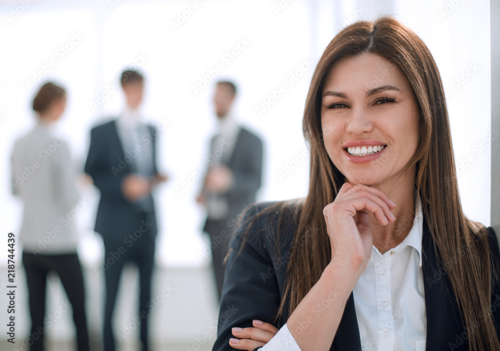 smiling business woman on blurred office background smiling business woman on blurred office background
