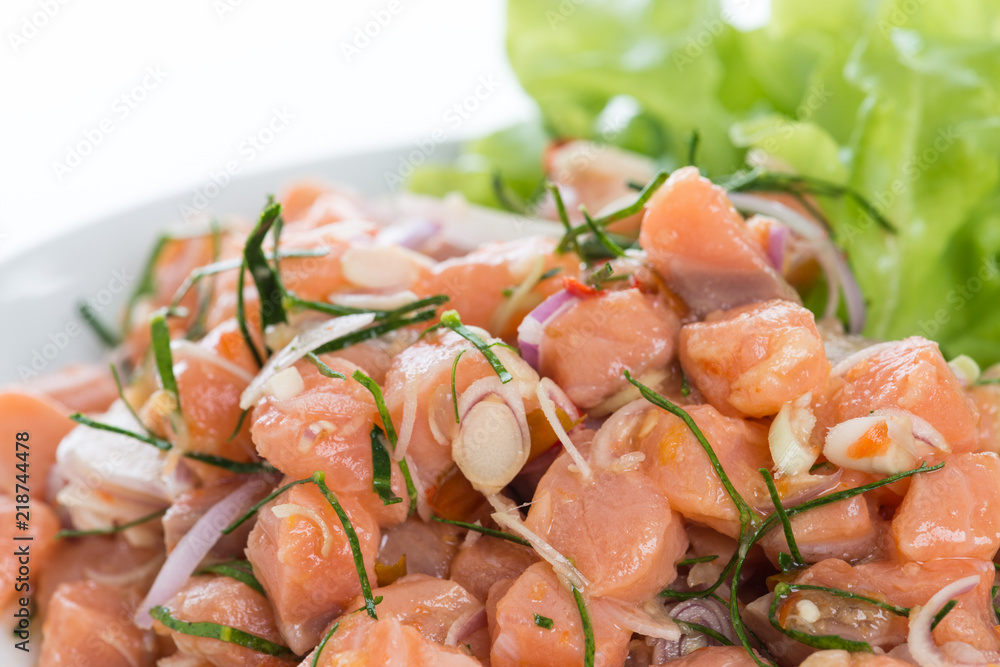 Salmon spicy salad with lemon grass isolated on white background Salmon spicy salad with lemon grass isolated on white background