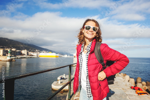 Happy beautiful girl woman traveler travels through the island of Corsica, France, Bastia © olezzo