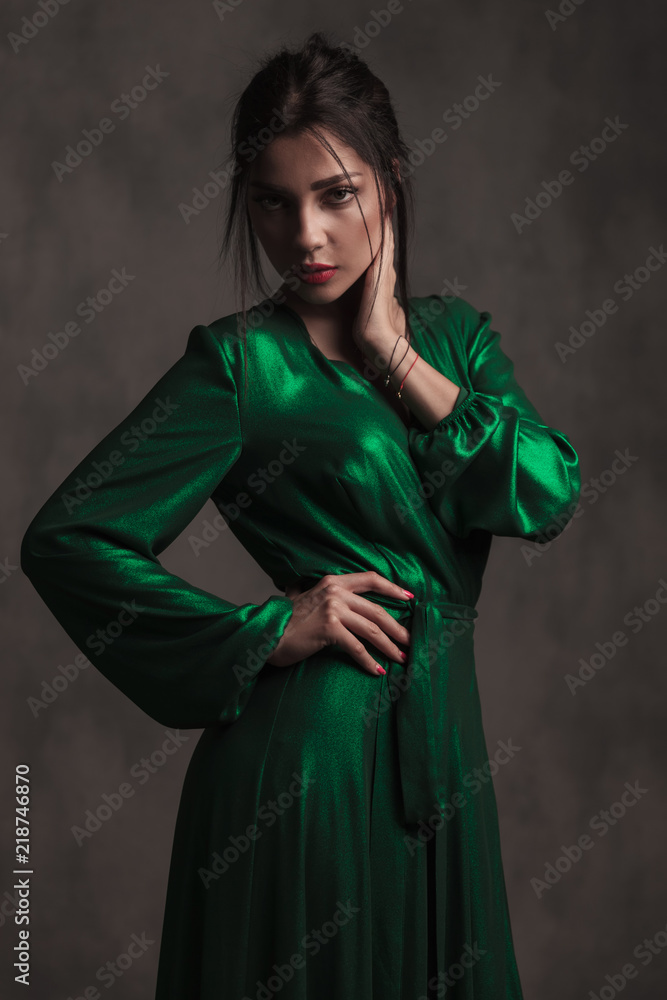 elegant woman in green silk dress looking seductively elegant woman in green silk dress looking seductively