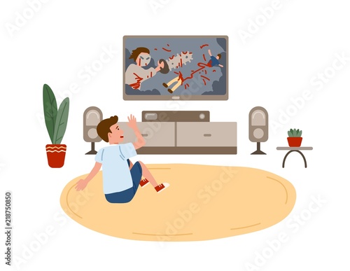 Kid boy sitting on round carpet and watching horror movie or film demonstrating violent behavior on TV set at home. Children and violence on television. Vector illustration in flat cartoon style.