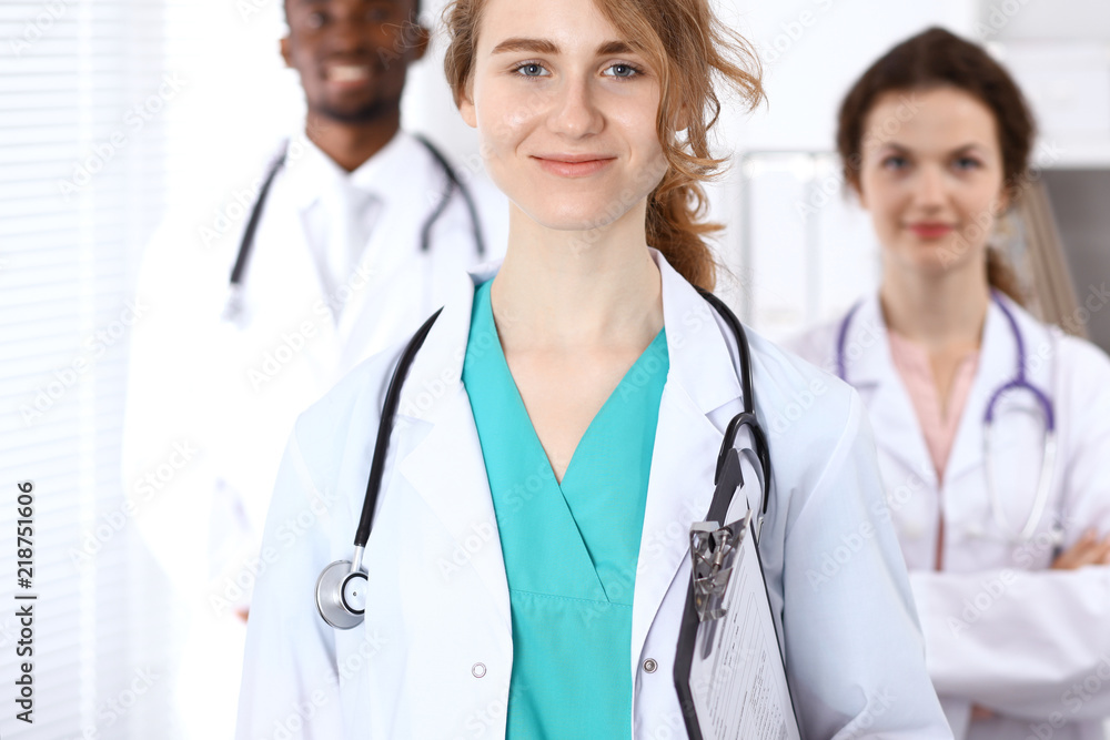Happy doctor woman with medical staff at the hospital Happy doctor woman with medical staff at the hospital