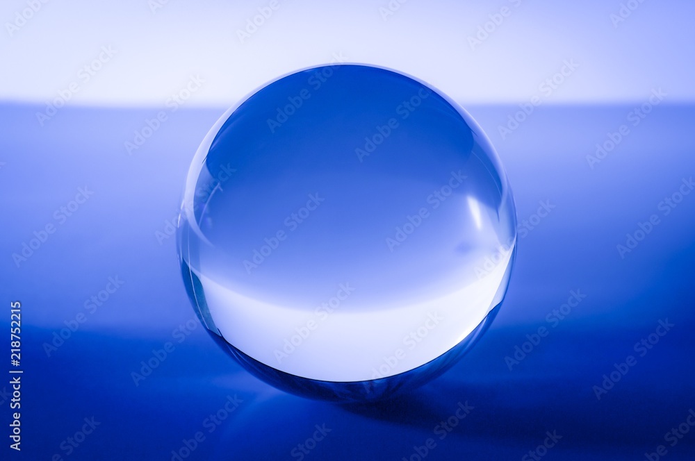 Obraz premium Glass ball in abstract blue