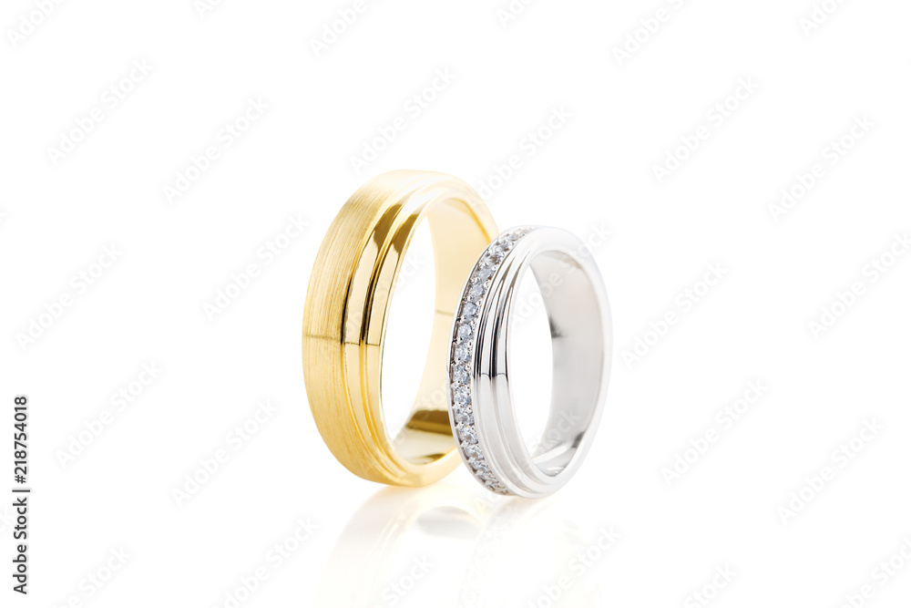 Gold and silver wedding rings isolated on white Gold and silver wedding rings isolated on white