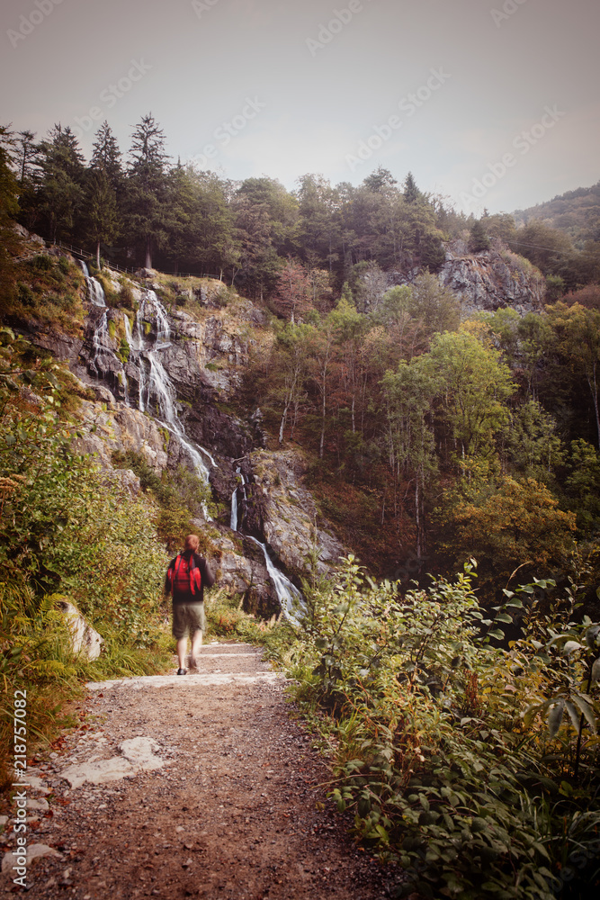 man hiking to the todtnauer waterfalls, holiday in the black forest