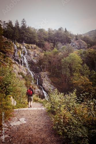 man hiking to the todtnauer waterfalls, holiday in the black forest