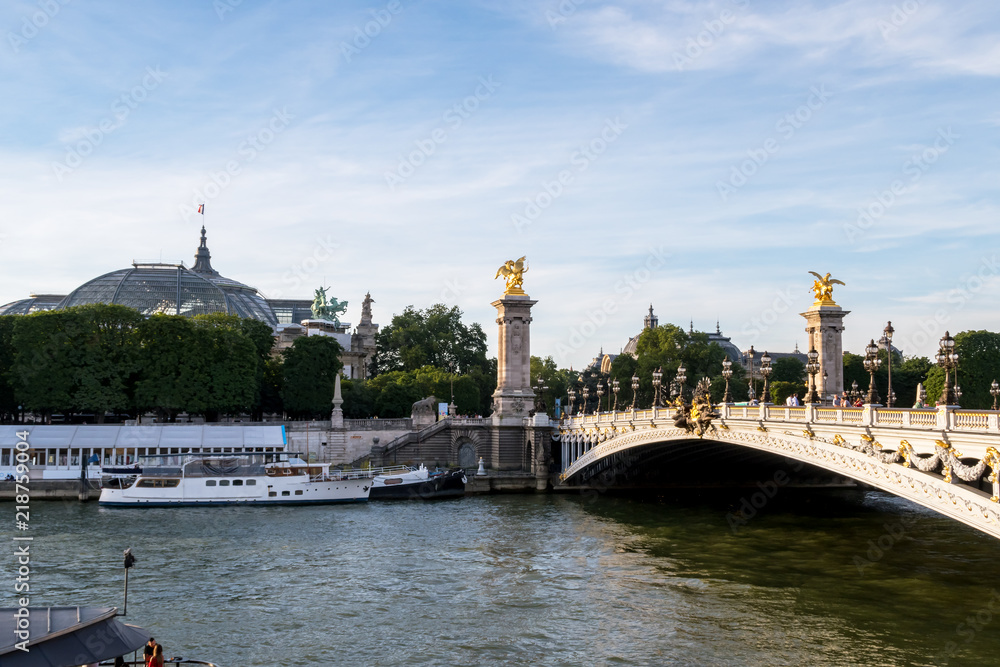 Pont Alexandre III on Seine River with Grand Palais in background - Paris France