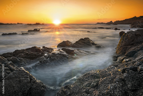 Romantic sunset over rocky coast and soft silky water © Ben Burger Foto Graz