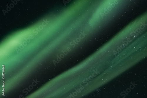 View at the northern lights in the night sky.