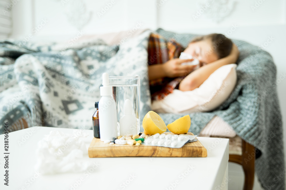 ill young girl with fever spending time at home ill young girl with fever spending time at home