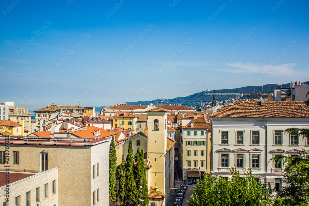 picturesque beautiful small italian city from above with many roof of houses in summer colorful contrast hot day time