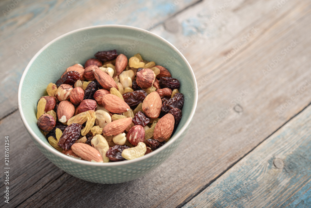Mix nuts in bowl Mix nuts in bowl