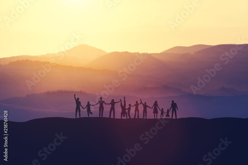Obraz na plátně Group of happy people at sunset