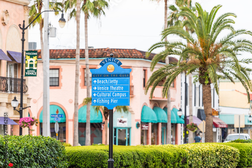 Fototapeta Naklejka Na Ścianę i Meble -  Sign in Venice, small Florida retirement city, town, or village with colorful architecture, in gulf of Mexico, palm trees on street