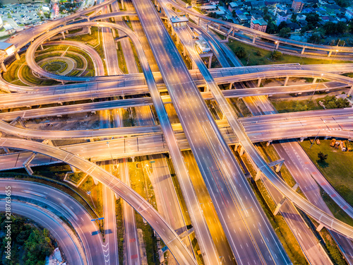 Top view of Highway road junctions at night. The Intersecting freeway road overpass the eastern outer ring road of Bangkok, Thailand. photo