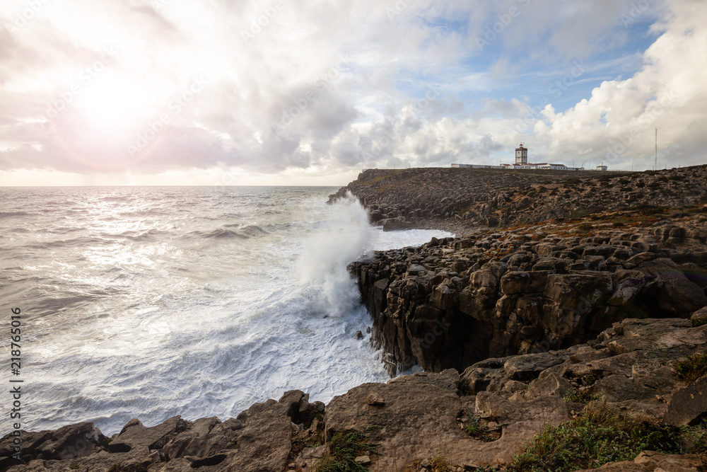 Lighthouse of Carvoeiro Cape at stormy weather, Peniche, Portugal