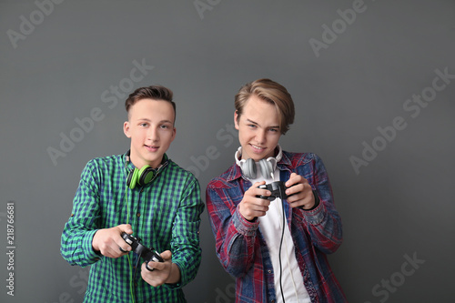 Teenagers with gamepads on ...
