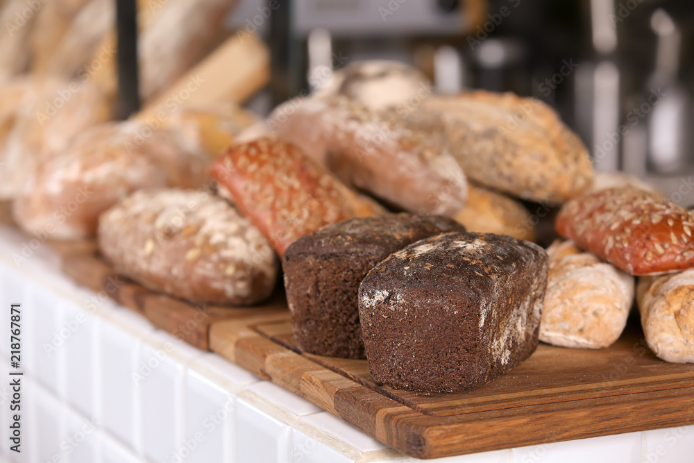 Assortment of fresh bread on counter in bakery Assortment of fresh bread on counter in bakery
