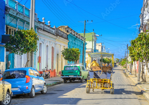 cart walks along the street of the old provincial Cuban town © Tortuga
