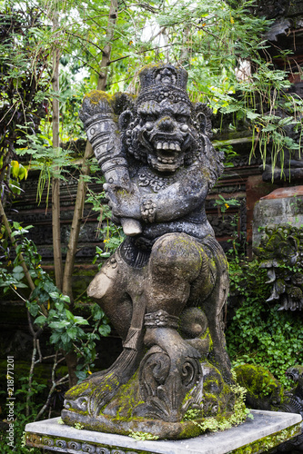Statue of old stone cruel monkey Hindu temple, Ubud, Bali