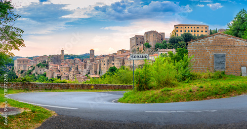 Panorama of the picturesque medieval village of Sorano located on a hill at sunset, Tuscany. Italy