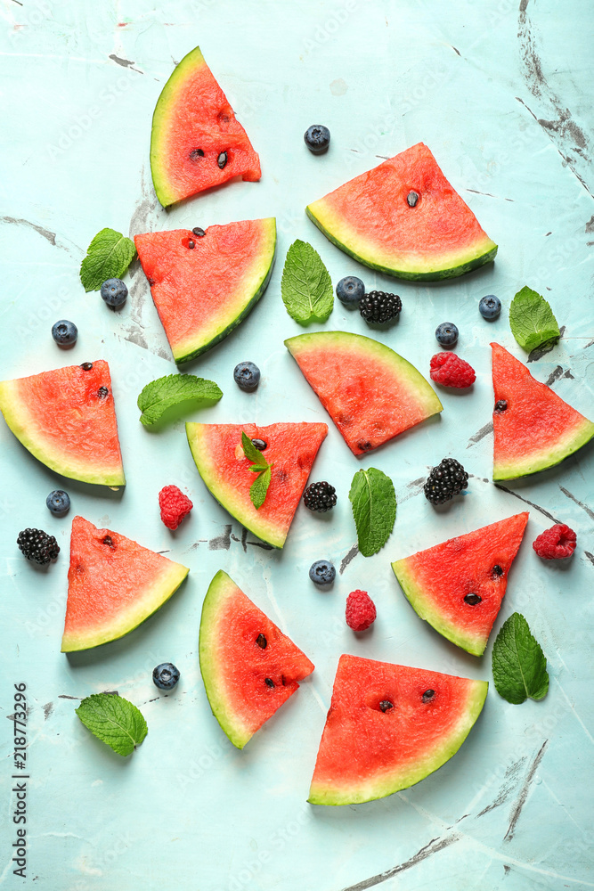 Delicious sliced watermelon and berries on light background Delicious sliced watermelon and berries on light background