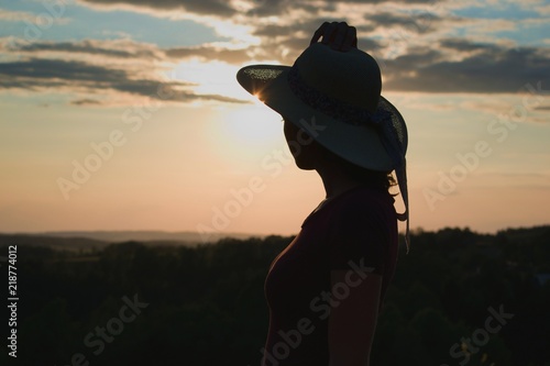  Young woman in sunset light. Nature, outdoor, freedom, success, happiness concept