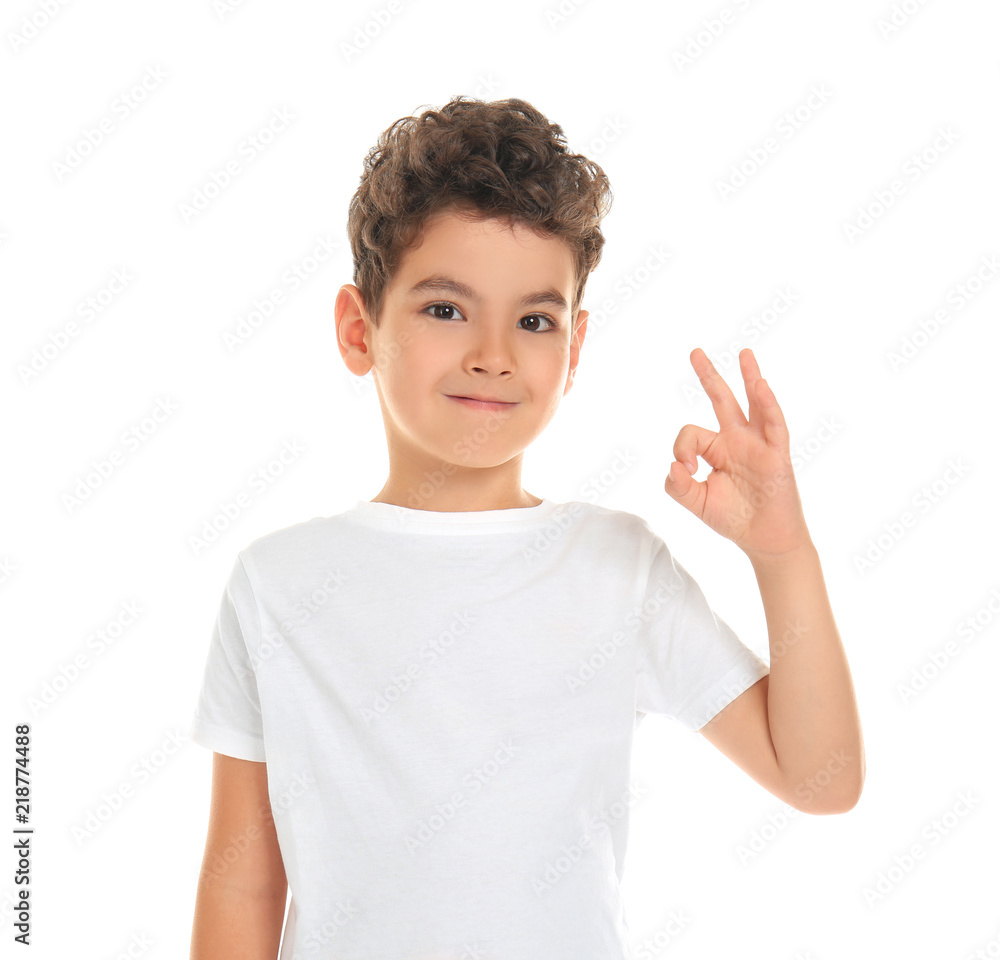 Cute little boy showing OK gesture on white background Cute little boy showing OK gesture on white background