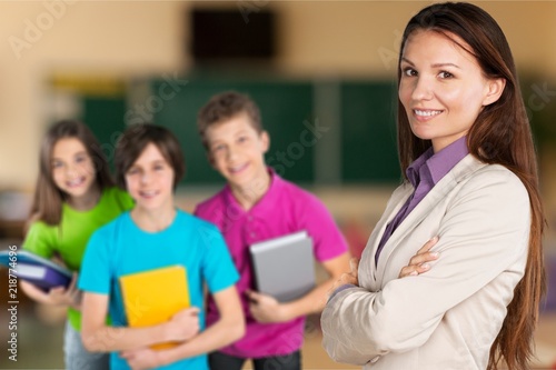 Female teacher with children at class