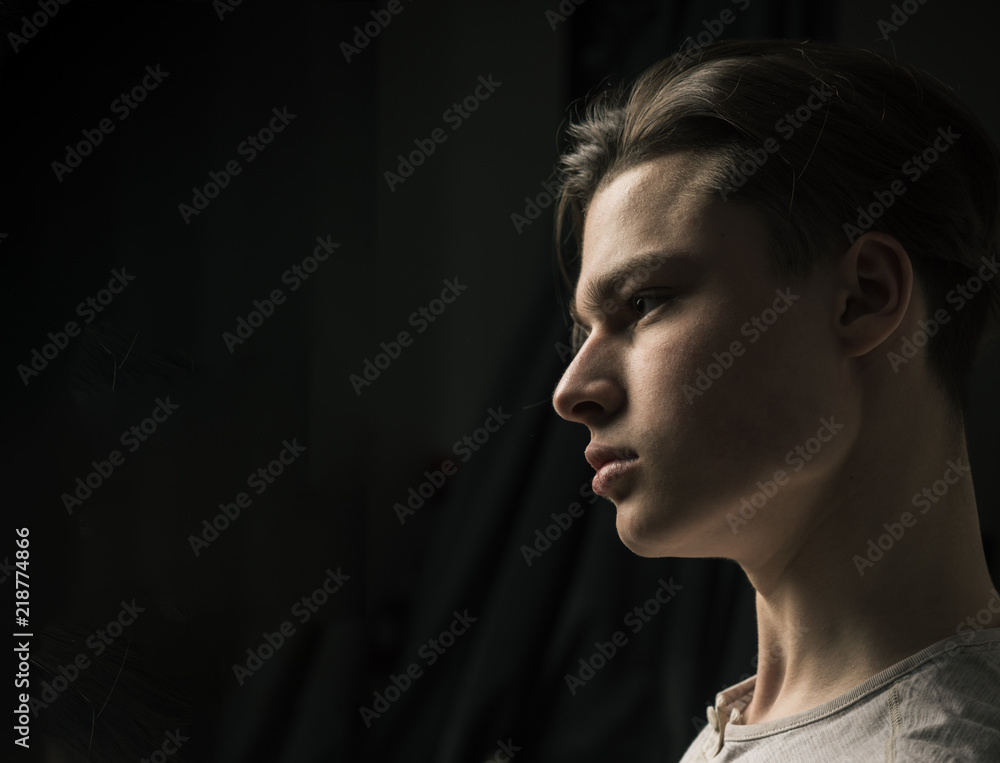 Guy on confident face in light shirt, black background. Macho with