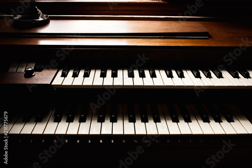 Konstfotografi Double keyboard piano detail in natural window light.