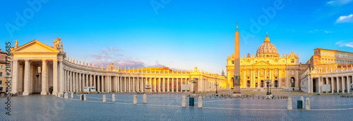 Panorama of St. Peter's Square illuminated by the first rays of the morning sun, the Vatican. Italy