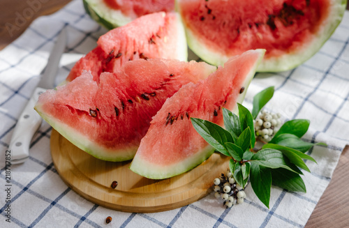 Slices of a watermelon on plate on a table