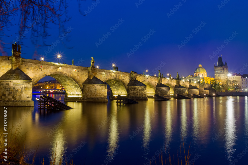 Night over Carlos bridge over Vltava river in Prague - Czech Republic