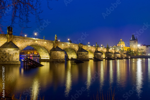 Night over Carlos bridge over Vltava river in Prague - Czech Republic