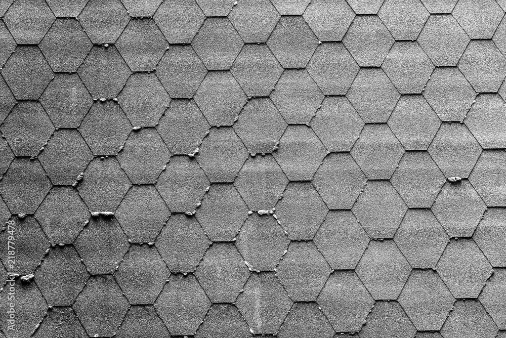 Bitumen shingles as an abstract monochrome background.